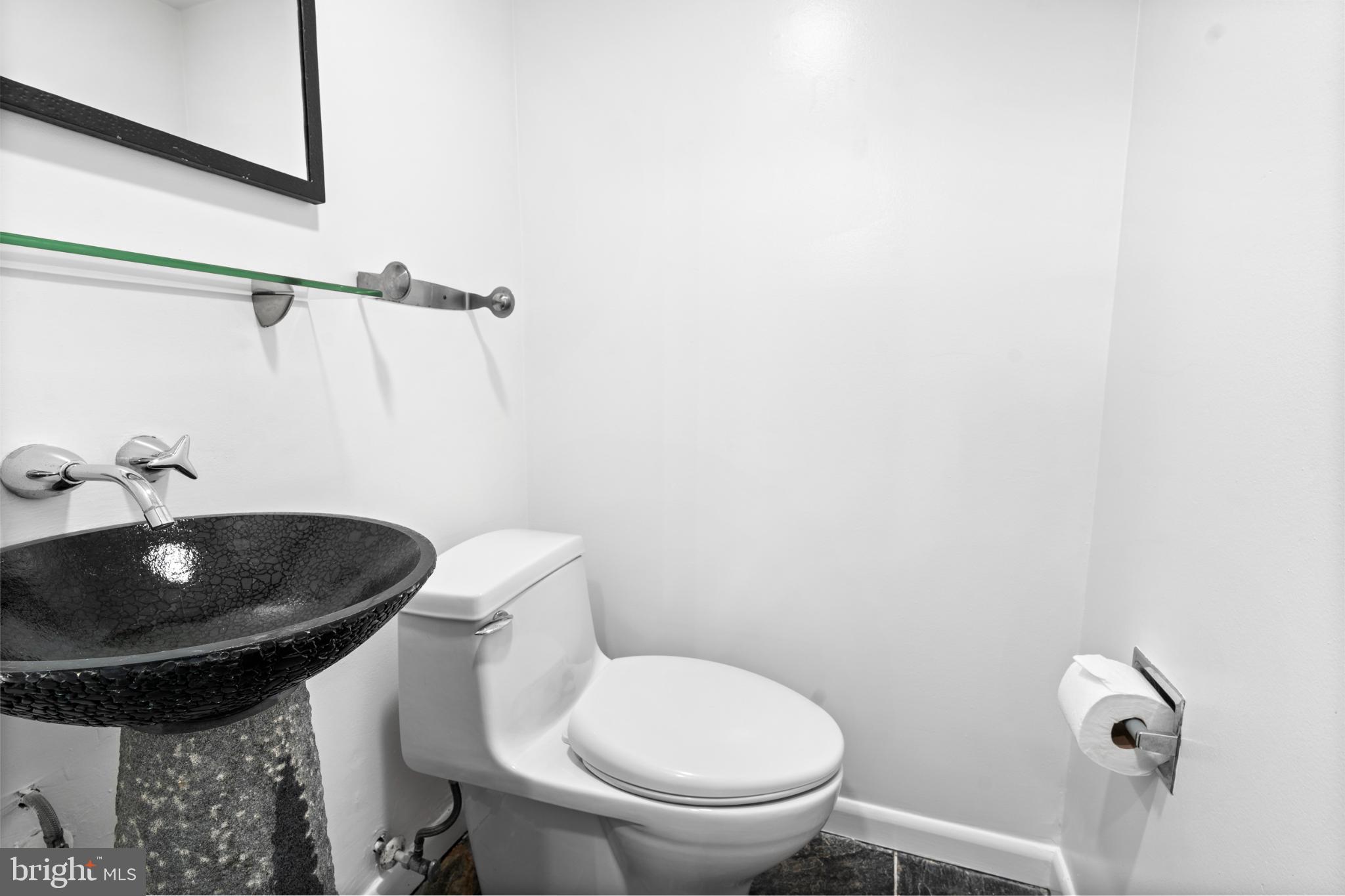 73 G Street Southwest, Unit 103 Washington, DC 20024 - Photo 11 of 35 a bathroom with a toilet and sink