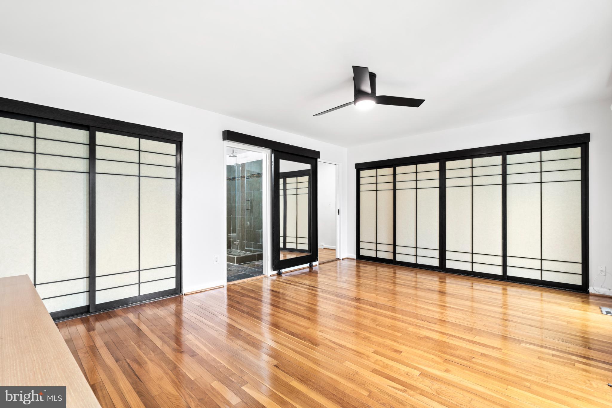 73 G Street Southwest, Unit 103 Washington, DC 20024 - Photo 18 of 35 wooden floor in an empty room with a window