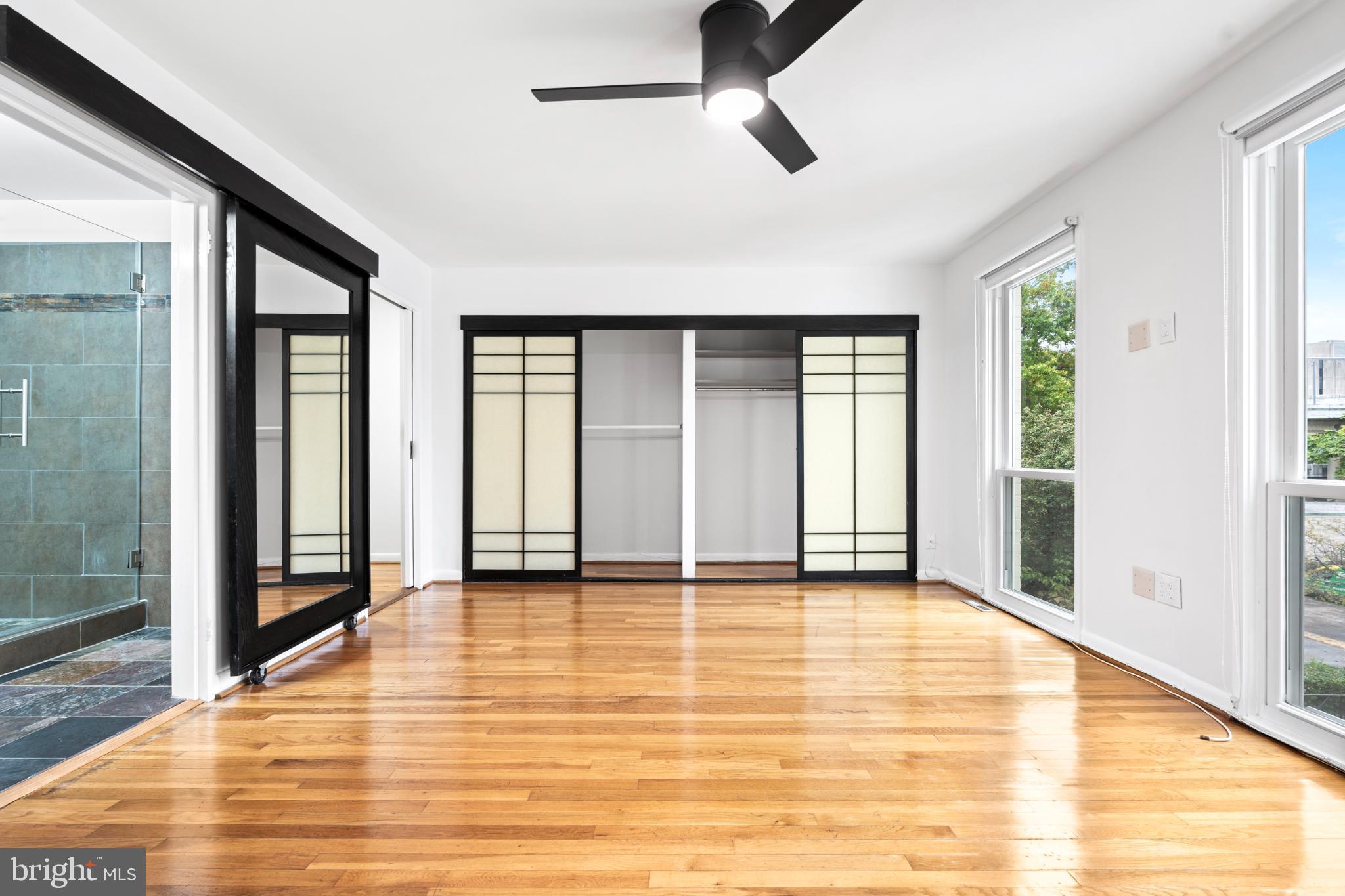 73 G Street Southwest, Unit 103 Washington, DC 20024 - Photo 19 of 35 a view of an empty room with window and a bathroom