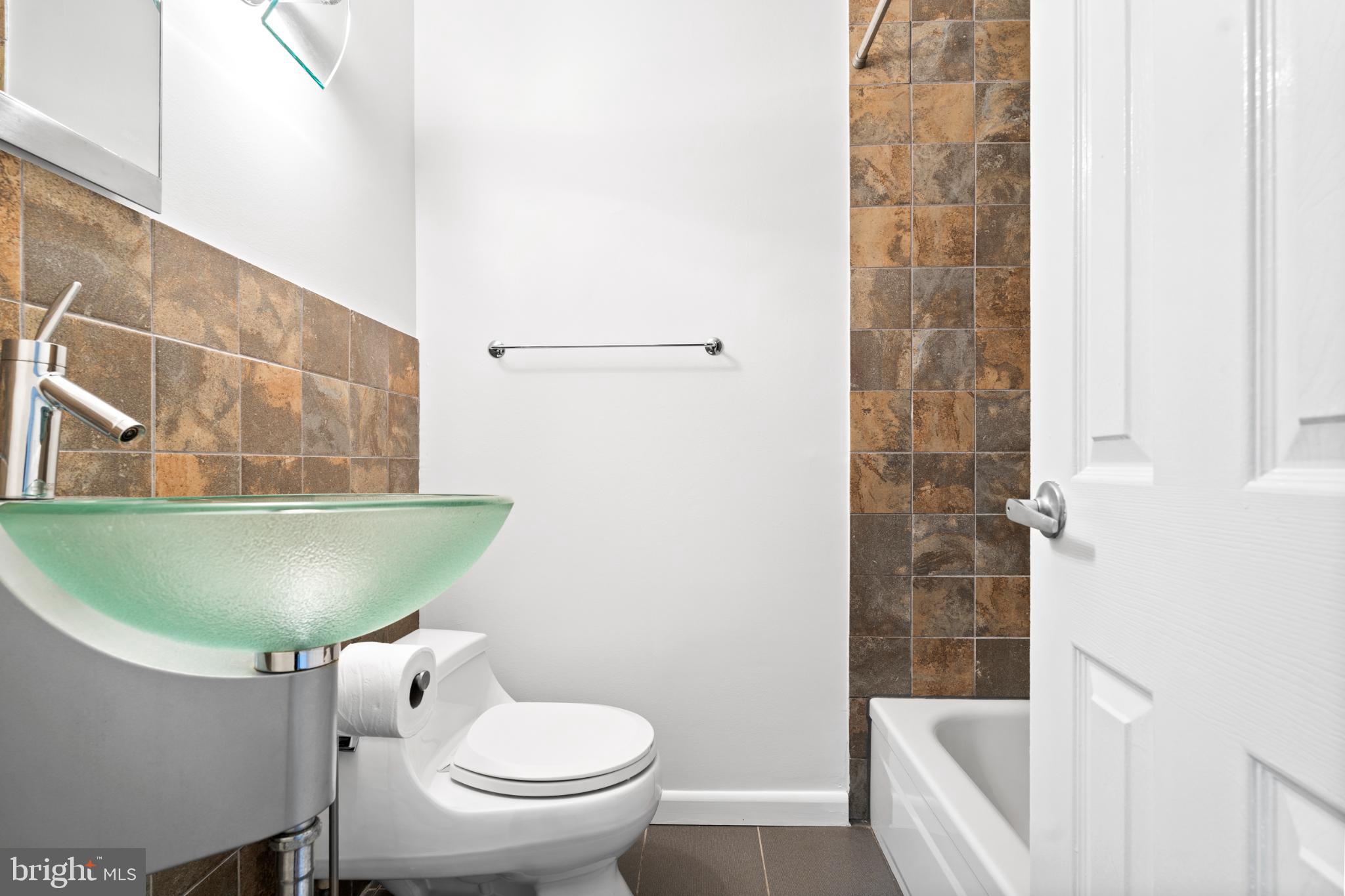 73 G Street Southwest, Unit 103 Washington, DC 20024 - Photo 25 of 35 a bathroom with a sink and a toilet