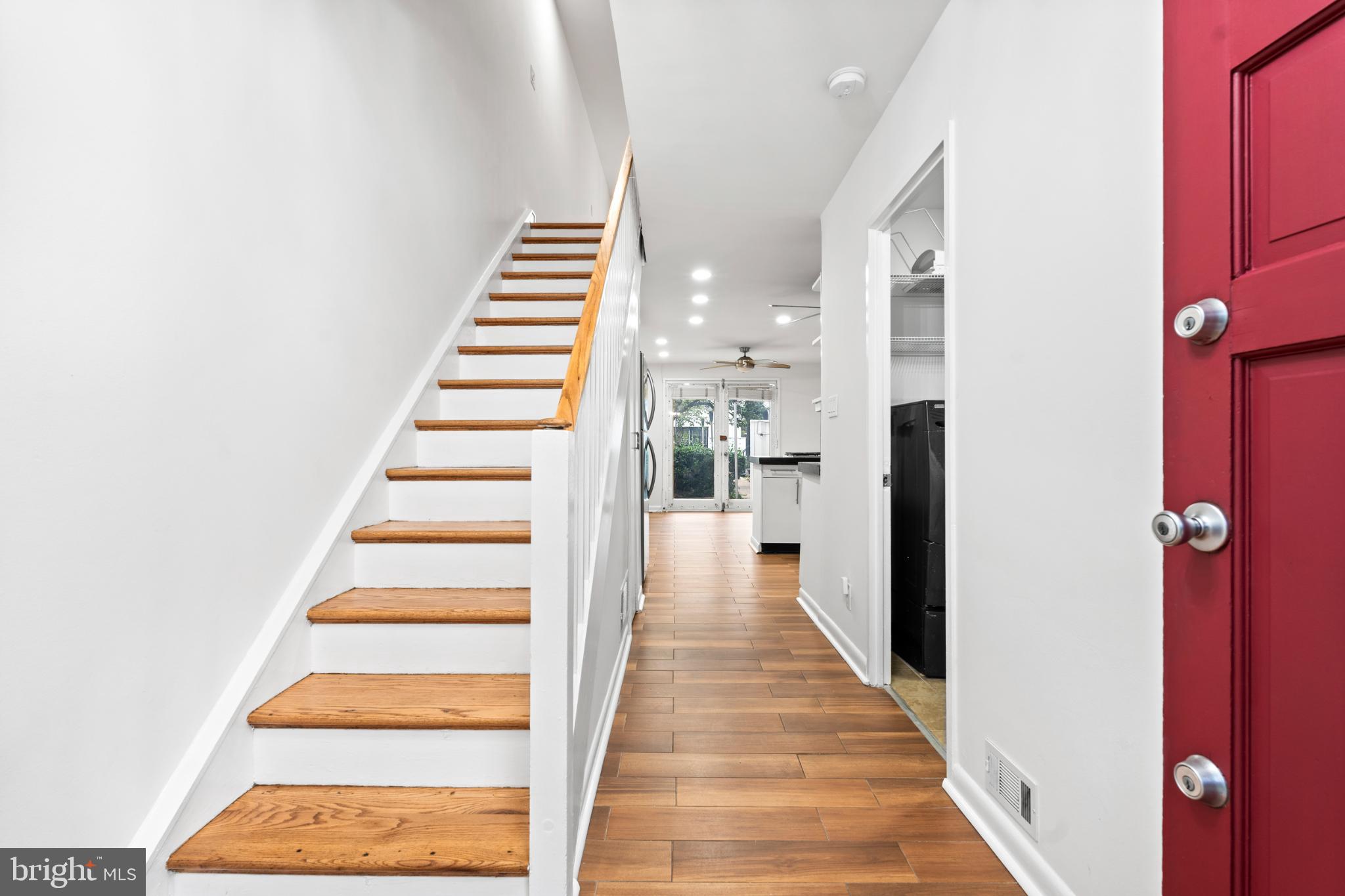 73 G Street Southwest, Unit 103 Washington, DC 20024 - Photo 3 of 35 a view of a hallway with white walls and railing