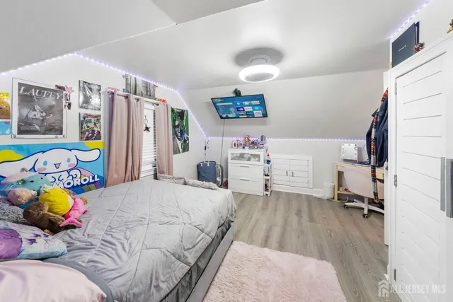 a bedroom with a bed furniture and a window