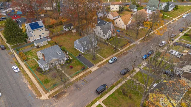 an aerial view of a residential houses with outdoor space