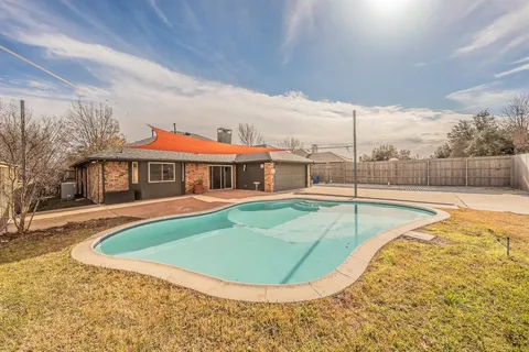 a view of a house with swimming pool