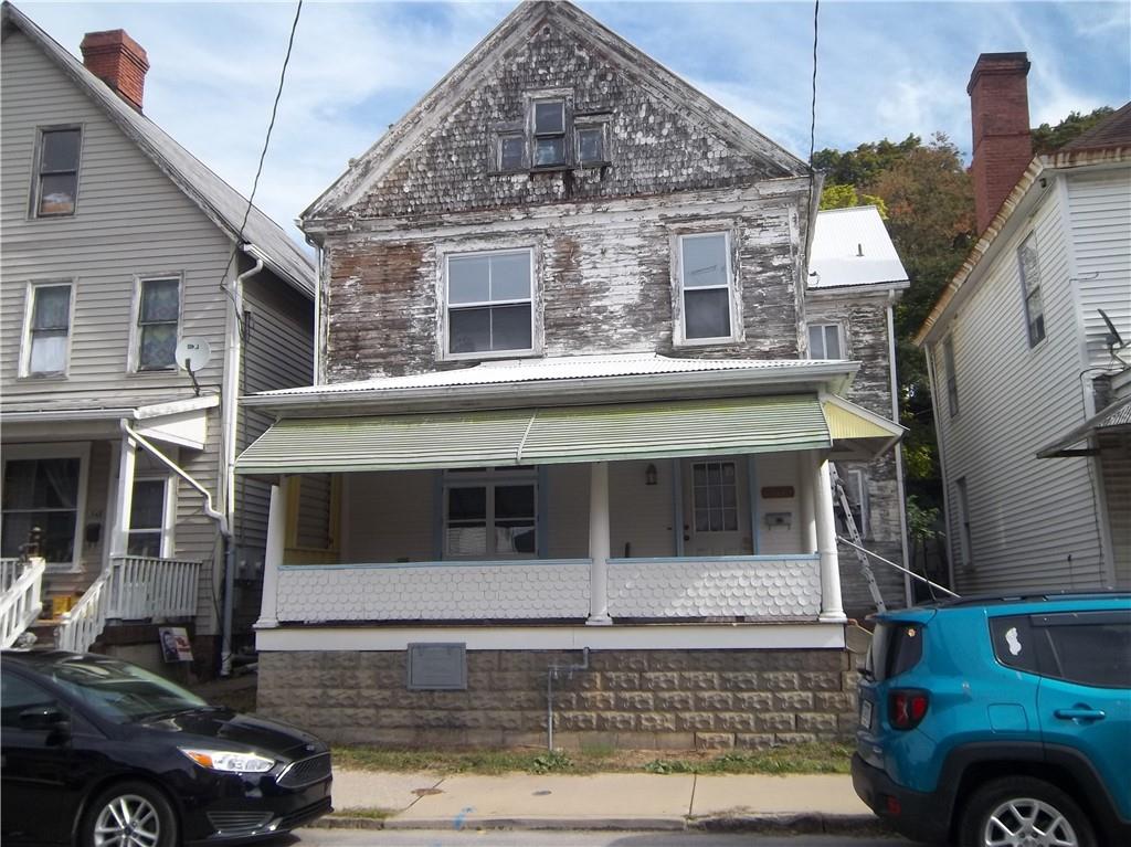 546 Hawthorne Avenue Kittanning, PA 16201 - Photo 1 of 3 a front view of a house with parking