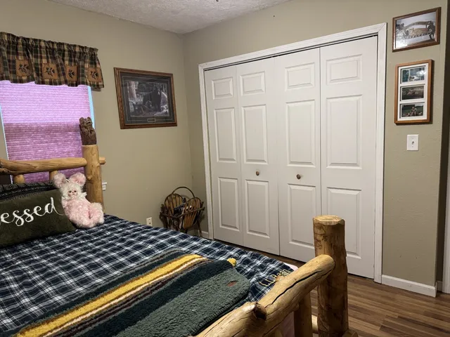 a bedroom with a bed and a stove