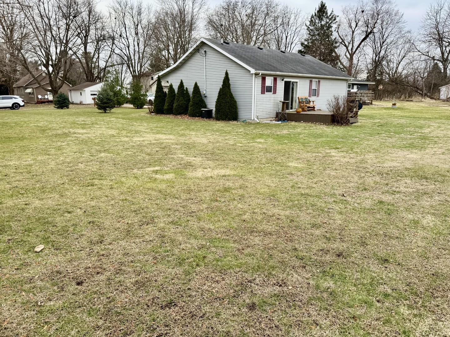 406 Edwards Street Granville, IL 61326 - Photo 2 of 13 a view of a house with a yard and garage