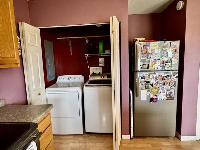 a view of storage and utility room with washer and dryer