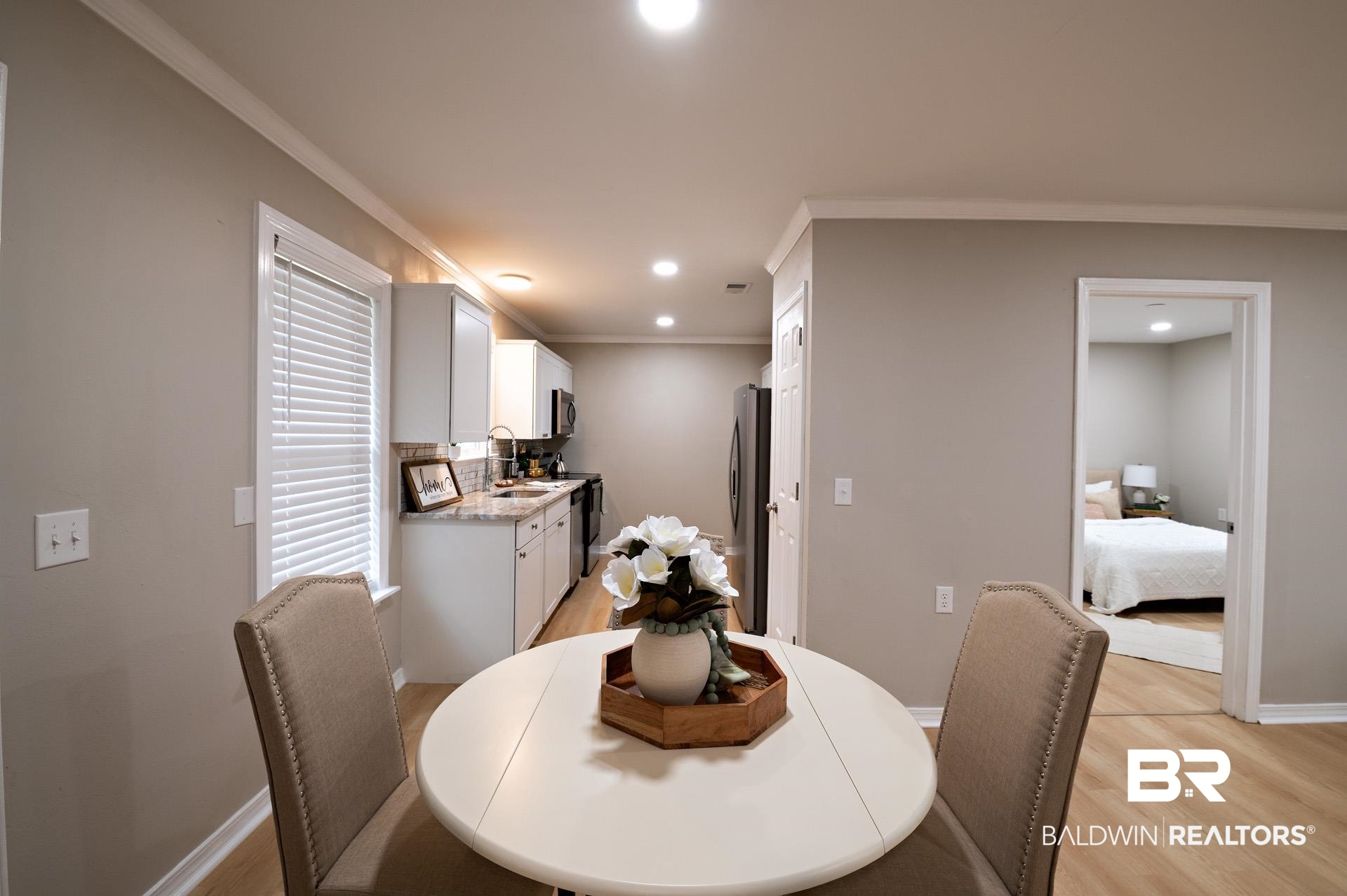 13474 Rooster Lane Foley, AL 36535 - Photo 22 of 39 Dining space with recessed lighting, crown molding, light wood-type flooring, and baseboards