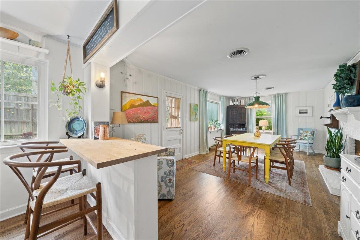 5283 Cole Road Memphis, TN 38120 - Photo 19 of 35 a view of a dining room with furniture and wooden floor