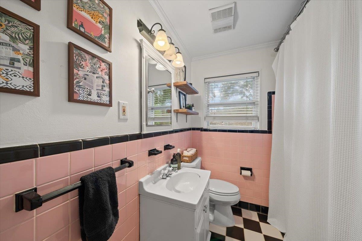 5283 Cole Road Memphis, TN 38120 - Photo 26 of 35 a bathroom with a sink mirror and toilet