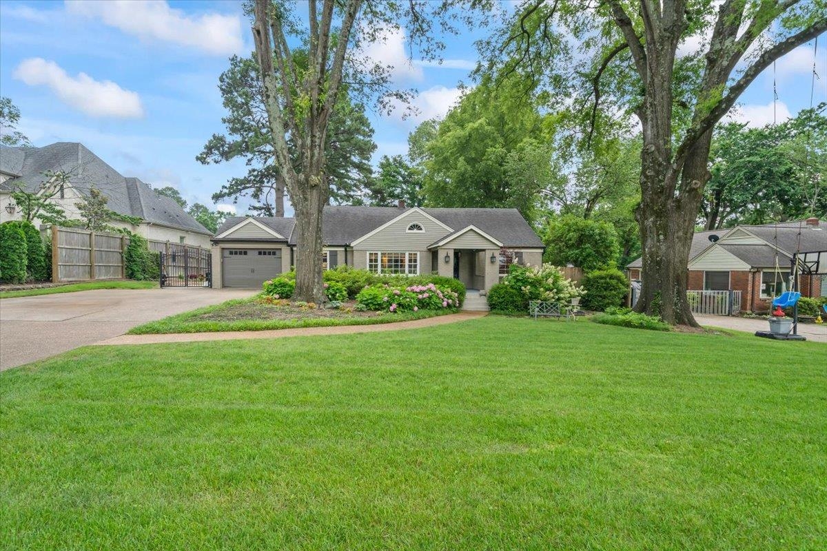5283 Cole Road Memphis, TN 38120 - Photo 3 of 35 a front view of a house with garden