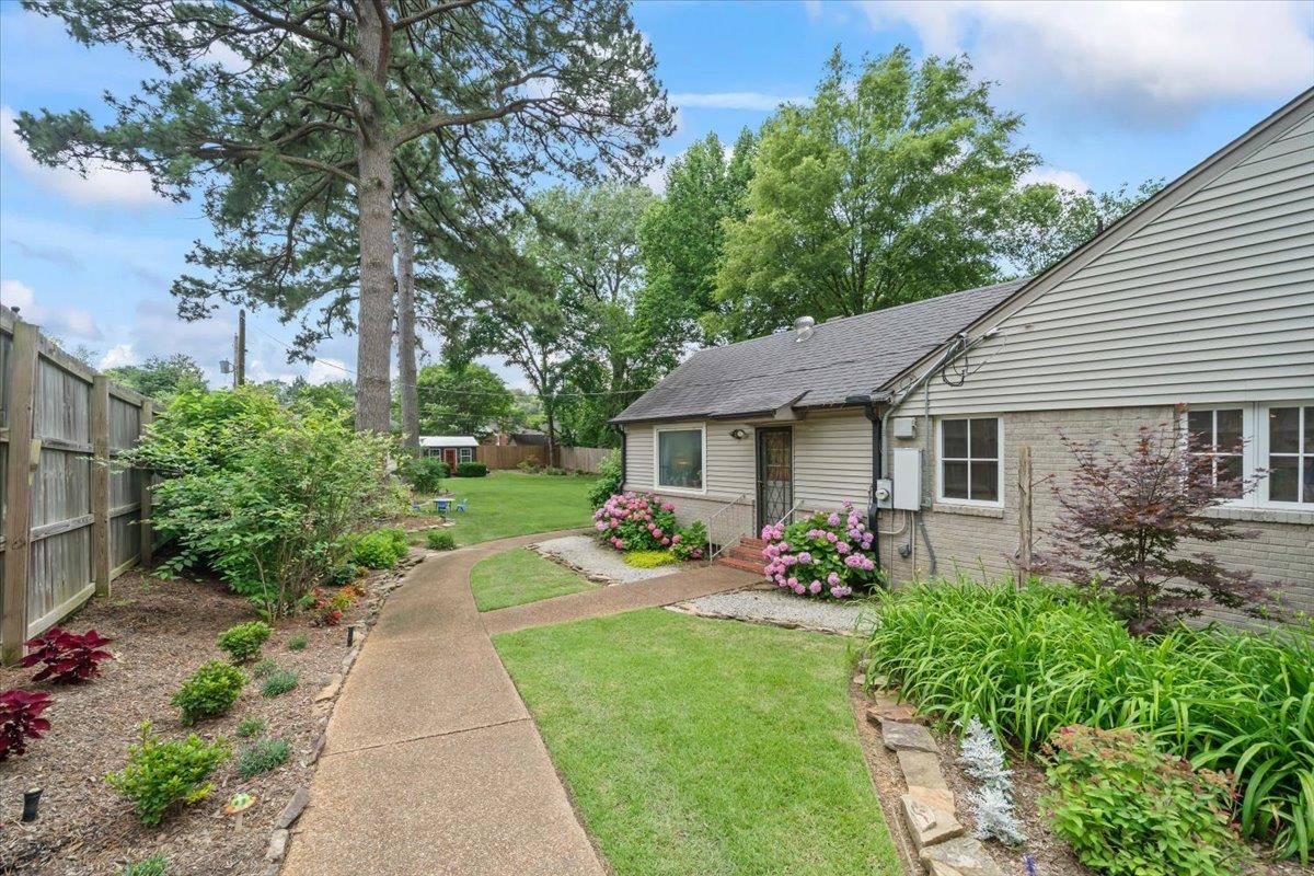 5283 Cole Road Memphis, TN 38120 - Photo 32 of 35 a front view of a house with garden