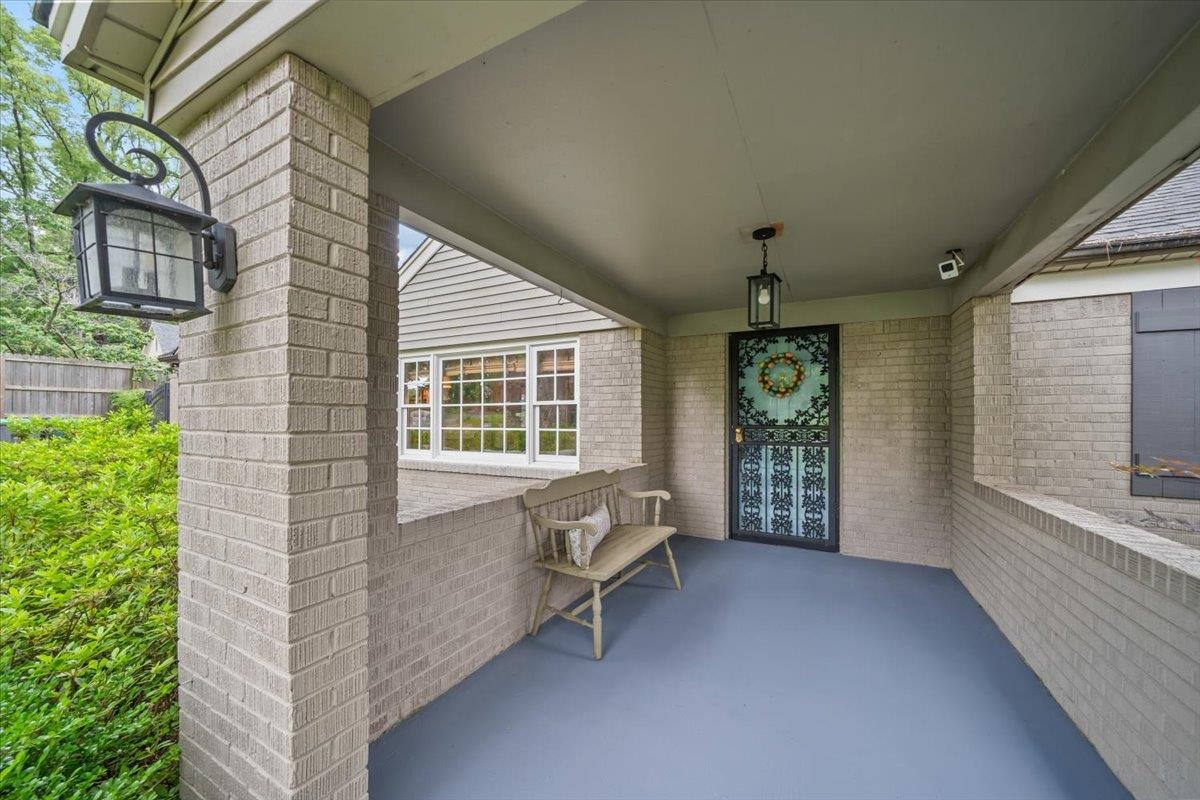 5283 Cole Road Memphis, TN 38120 - Photo 5 of 35 a balcony with furniture and window
