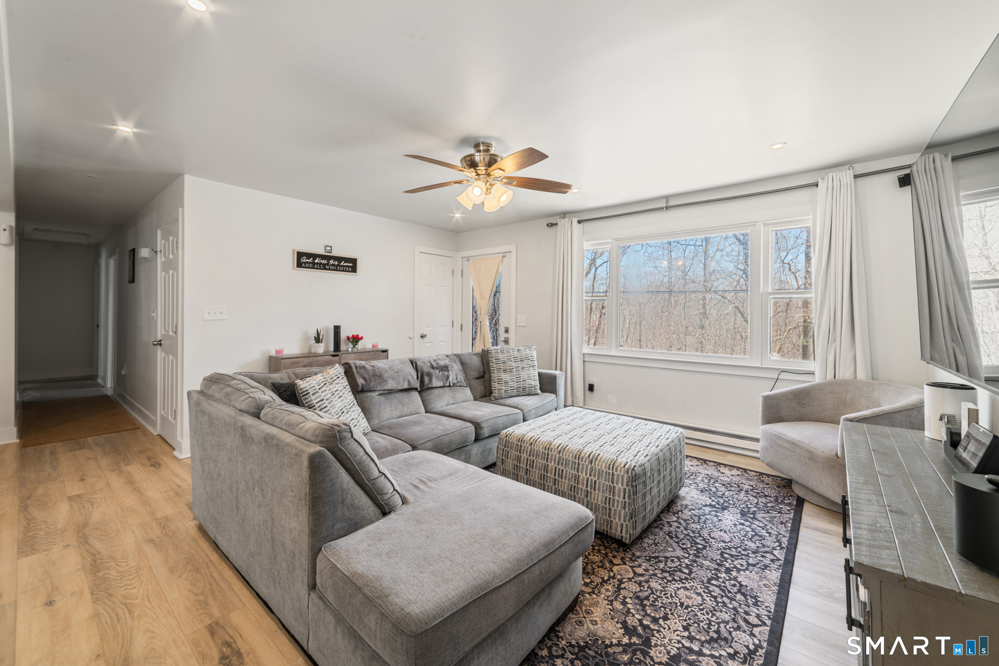 327 Lakeside Boulevard West Waterbury, CT 06708 - Photo 6 of 29 a living room with furniture and a large window