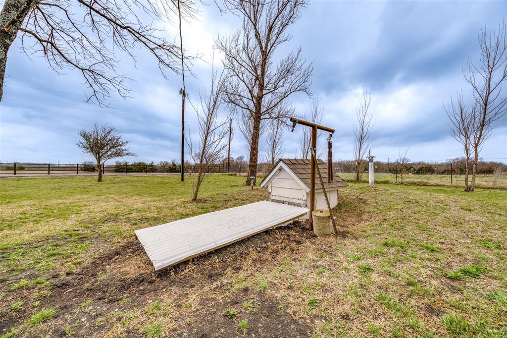 9309 West Ridge Road Anna, TX 75409 - Photo 24 of 28 Storm Shelter located on the side of the home