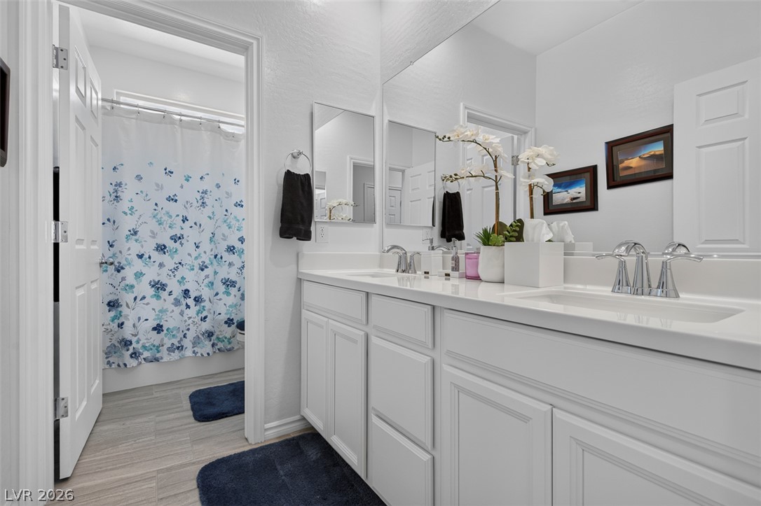 1824 Redland Ridge Street Henderson, NV 89002 - Photo 49 of 69 Dual vanities with pristine counters elevate daily routines.