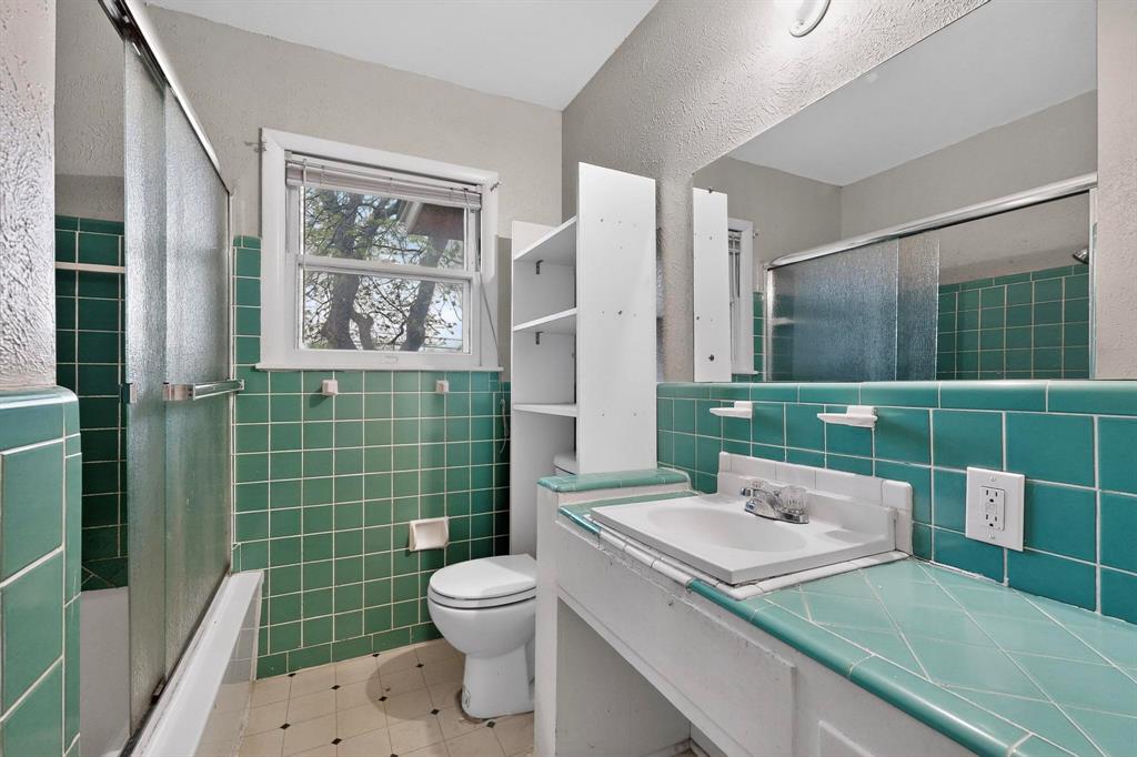 4508 Rutland Avenue Fort Worth, TX 76133 - Photo 23 of 36 a bathroom with a sink a toilet and shower