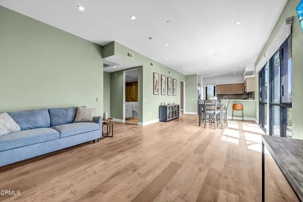 a living room with furniture and a table