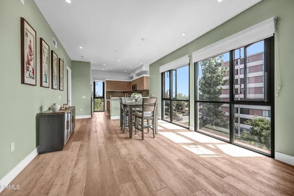 a view of a dining room with furniture window and wooden floor