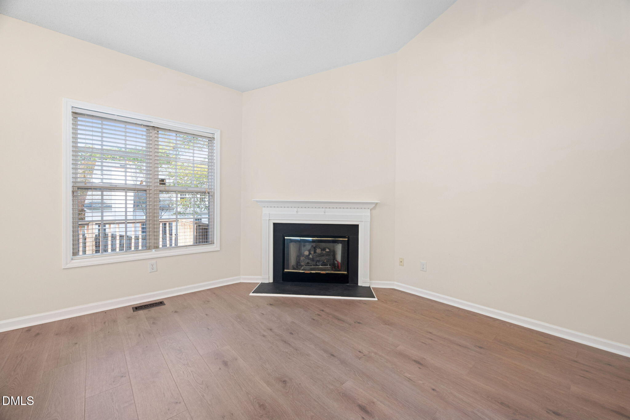 2524 Beech Gap Court Raleigh, NC 27603 - Photo 13 of 31 a view of an empty room with a window and fireplace