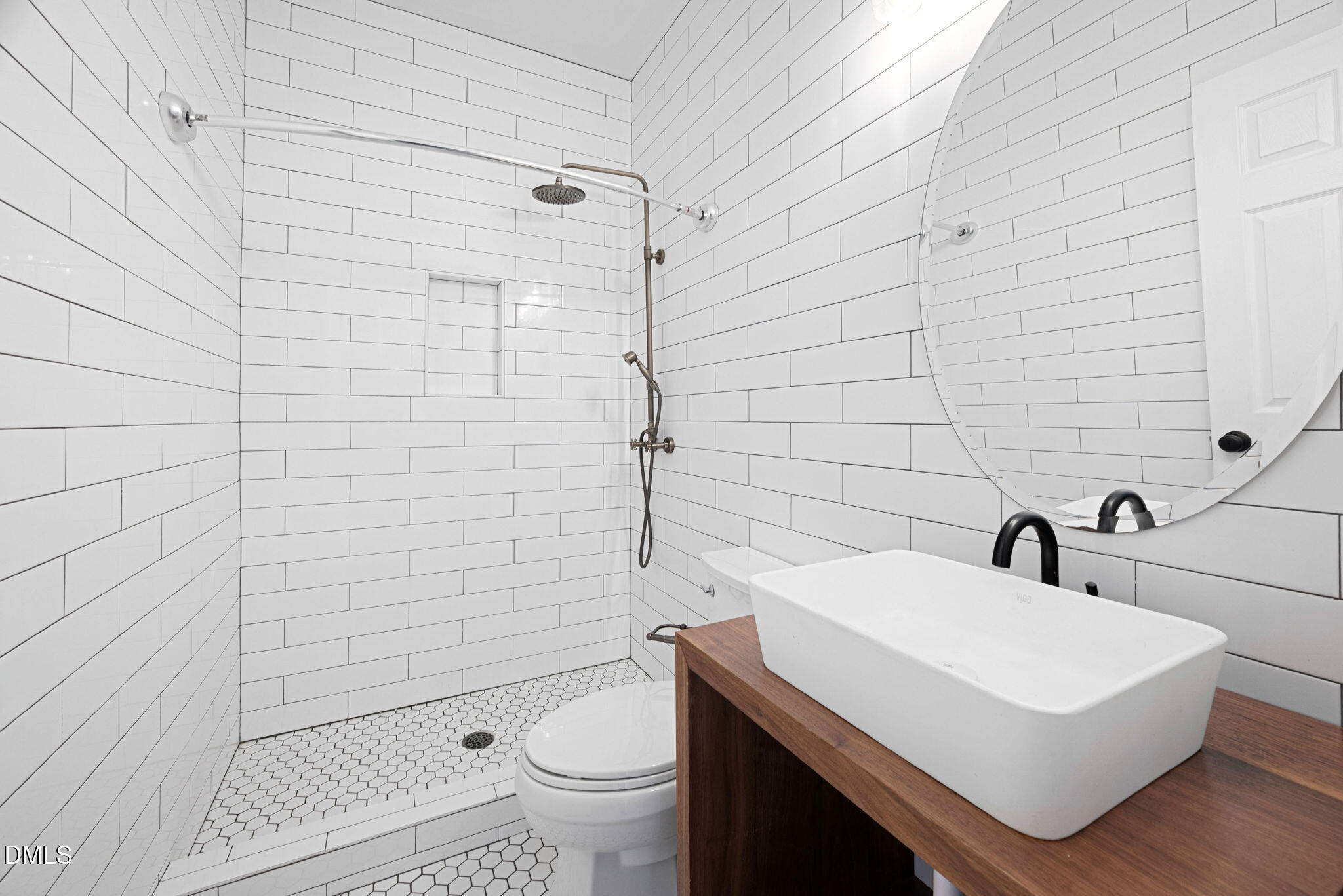 2524 Beech Gap Court Raleigh, NC 27603 - Photo 23 of 31 a bathroom with a sink a toilet and shower