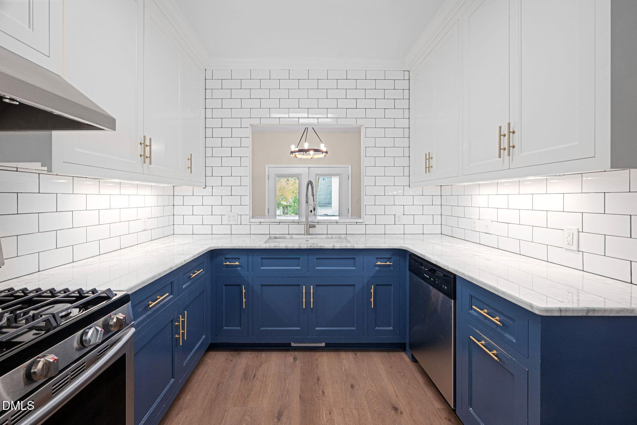 2524 Beech Gap Court Raleigh, NC 27603 - Photo 6 of 31 a kitchen with stainless steel appliances granite countertop wooden cabinets and a stove top oven