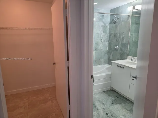 a view of a hallway with washer and dryer