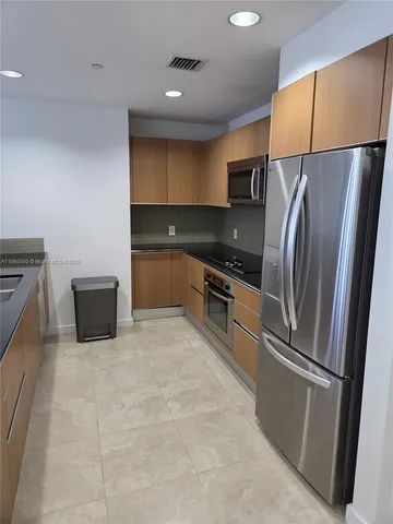 a view of a hallway with a chandelier