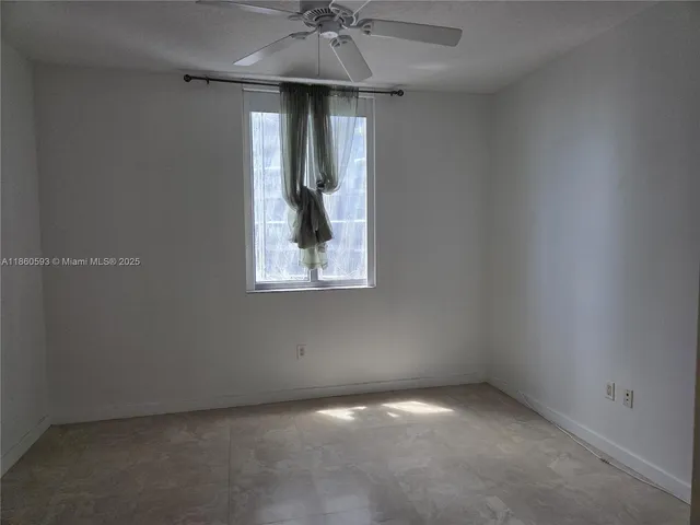 a bathroom with a double vanity sink a toilet and shower