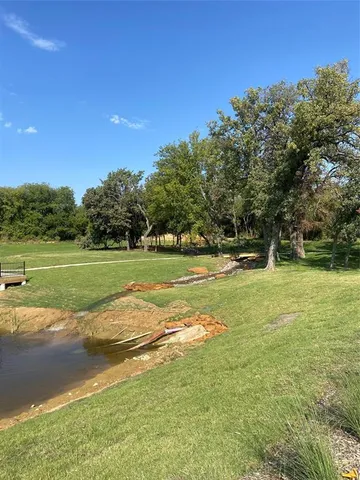 a view of a golf course with a lake