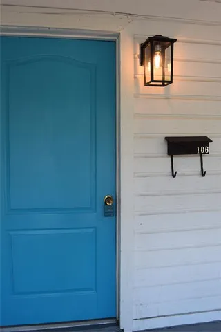 a view of front door and bedroom