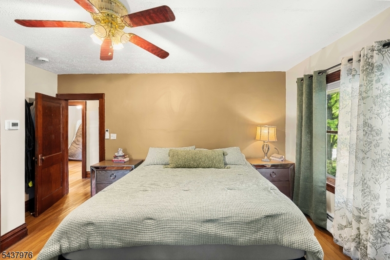 886 Brass Castle Road Belvidere, NJ 07823 - Photo 20 of 44 a bedroom with a bed and a chandelier
