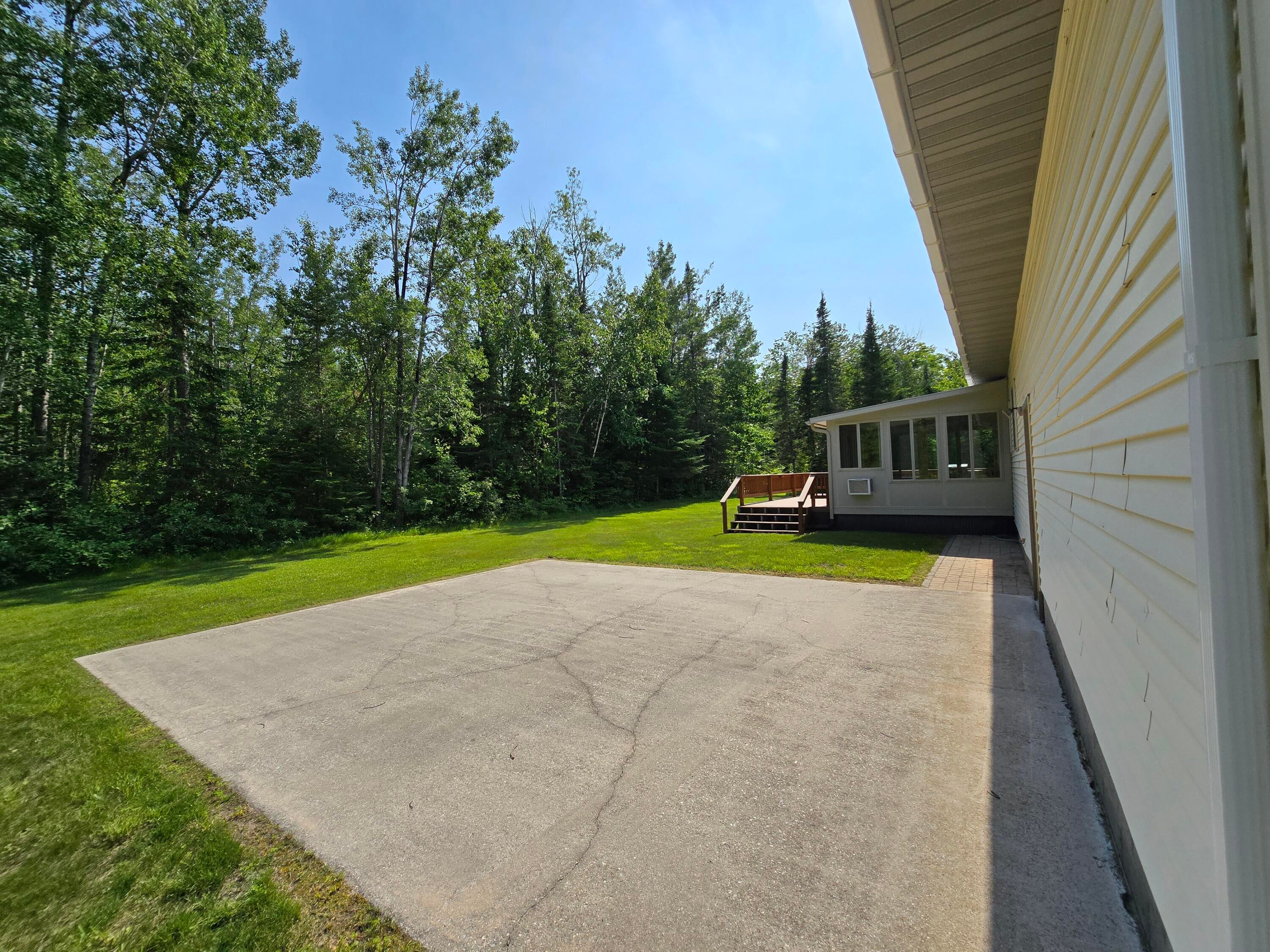 N705 Woods Road St. Ignace, MI 49781 - Photo 23 of 75 Large Cement pad off rear of garage