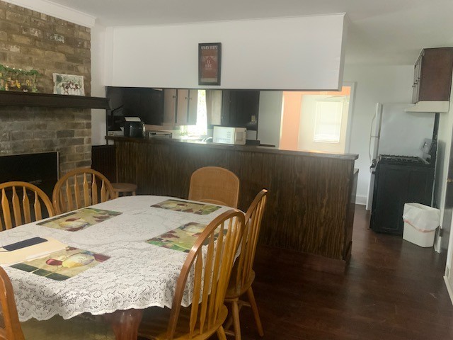 850 Slade Street Coldspring, TX 77331 - Photo 12 of 30 Breakfast area featuring a wood buring fireplace