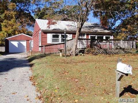 6 Bayview Court Poquott, NY 11733 - Photo 1 of 1 a front view of a house with a yard