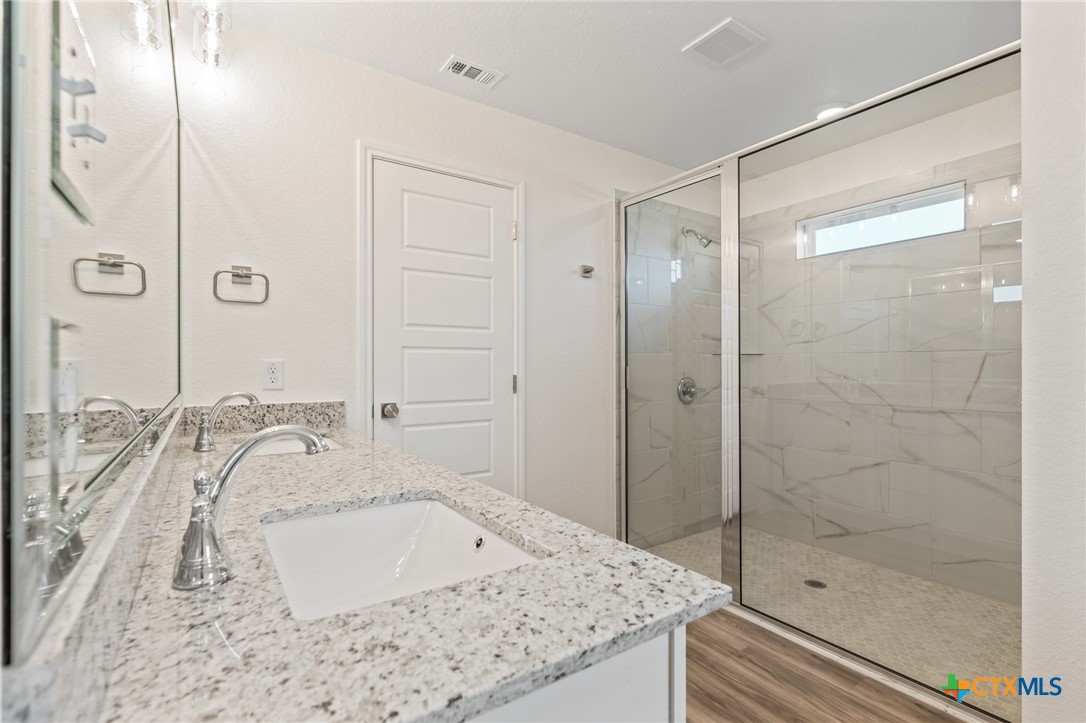 1204 Victory Ranch Trail Killeen, TX 76549 - Photo 15 of 33 a bathroom with a bathtub and a shower