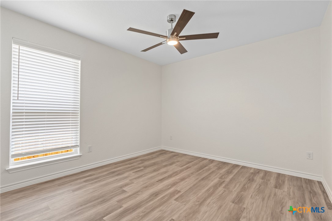 1204 Victory Ranch Trail Killeen, TX 76549 - Photo 20 of 33 an empty room with a window and a ceiling fan