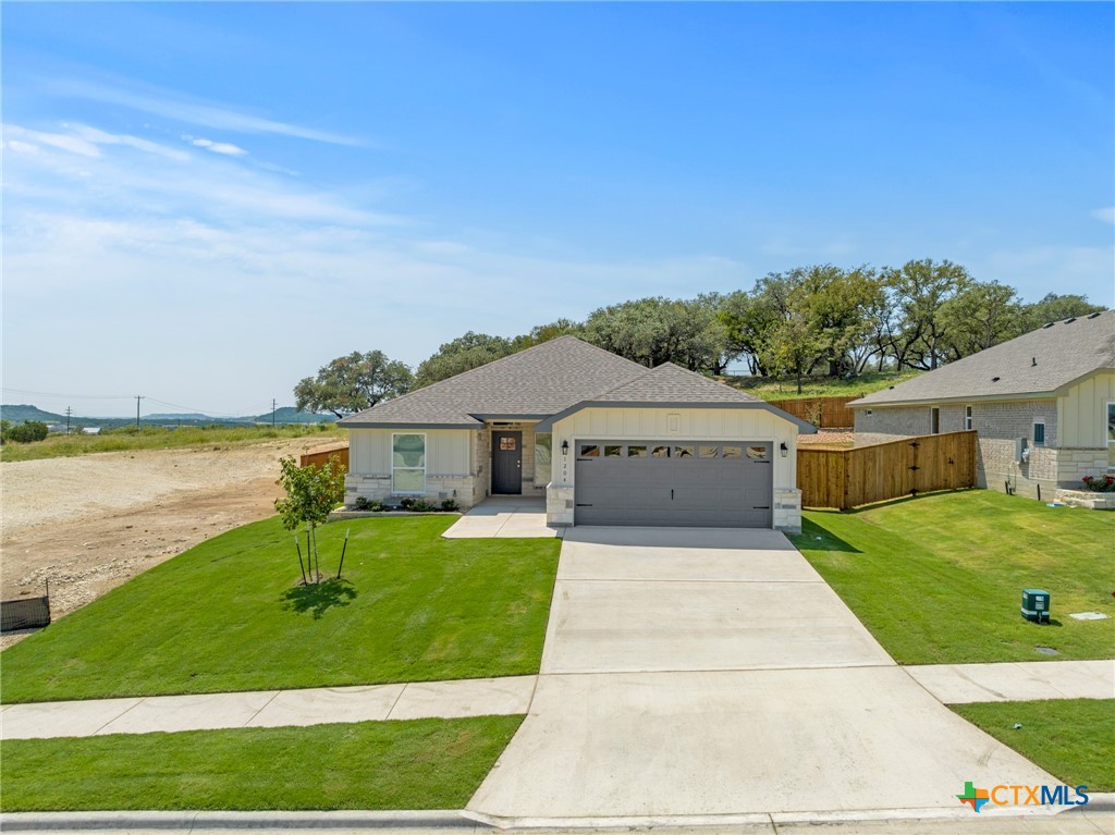 1204 Victory Ranch Trail Killeen, TX 76549 - Photo 2 of 33 a front view of a house with garden
