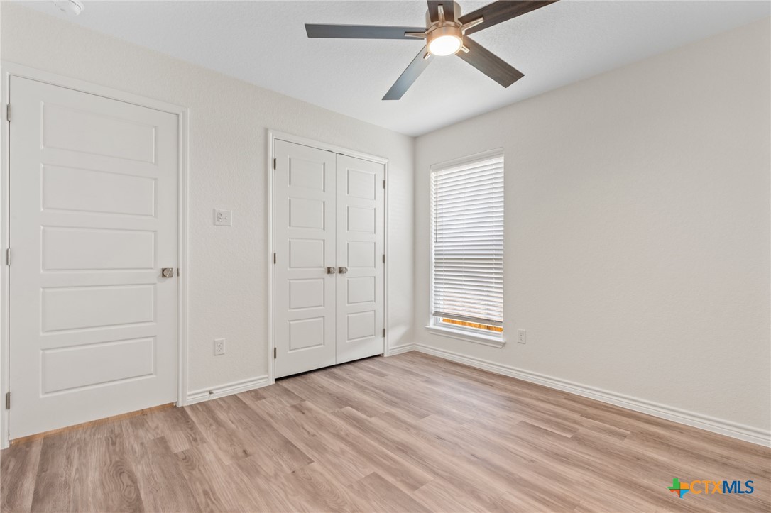 1204 Victory Ranch Trail Killeen, TX 76549 - Photo 21 of 33 an empty room with windows and fan