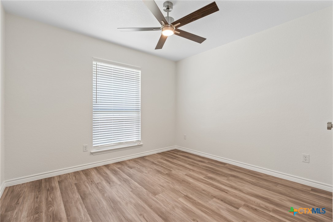 1204 Victory Ranch Trail Killeen, TX 76549 - Photo 22 of 33 an empty room with a window and a fan