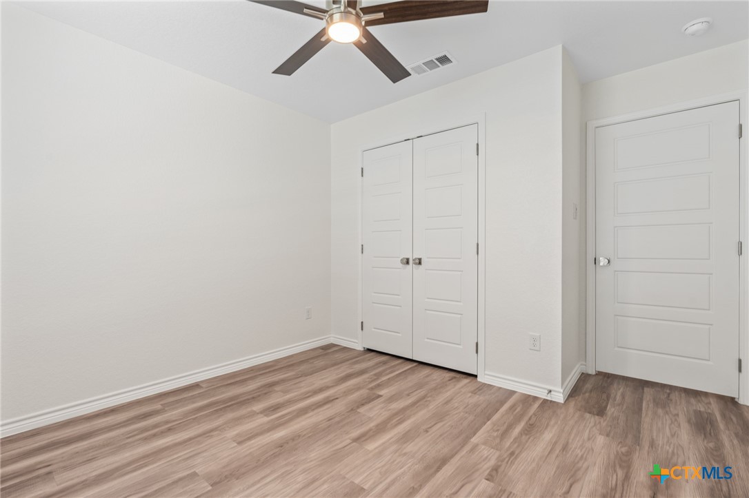 1204 Victory Ranch Trail Killeen, TX 76549 - Photo 23 of 33 wooden floor in an empty room