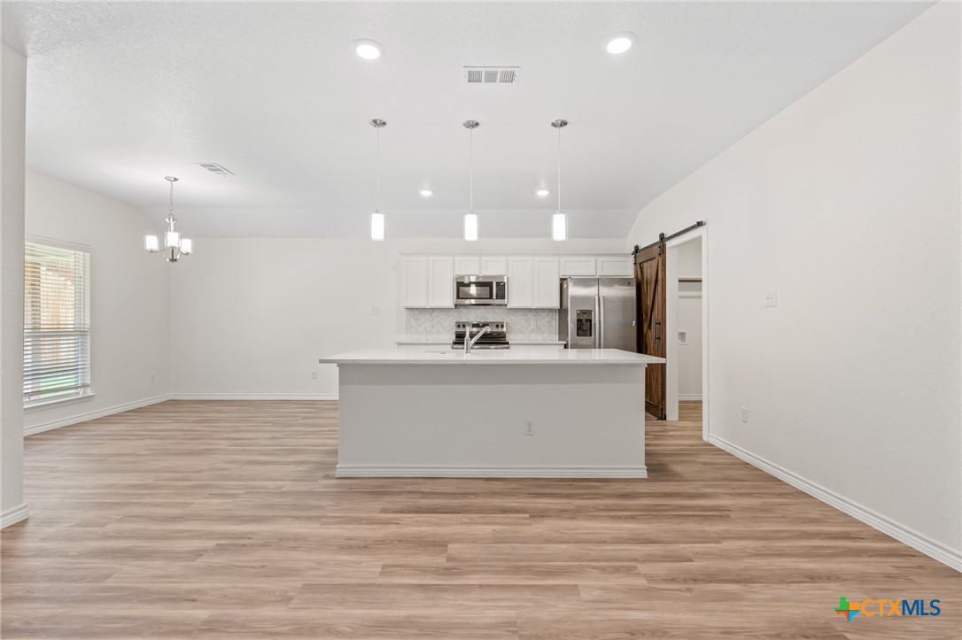 1204 Victory Ranch Trail Killeen, TX 76549 - Photo 8 of 33 a view of kitchen with stainless steel appliances cabinets