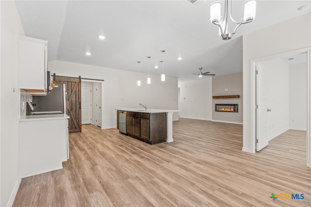 1204 Victory Ranch Trail Killeen, TX 76549 - Photo 10 of 33 a view of a kitchen with a sink and a refrigerator