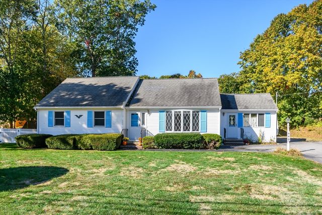 front view of a house with a yard