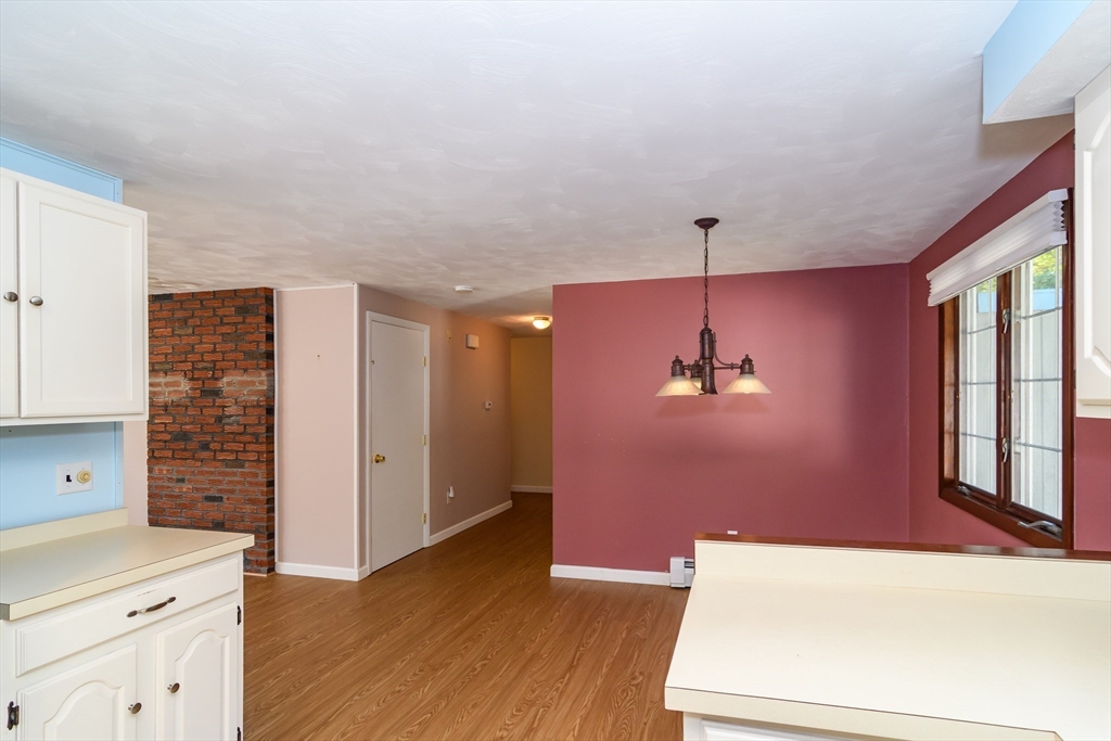 440 County Road Bourne, MA 02559 - Photo 11 of 27 wooden floor in an empty room with a window