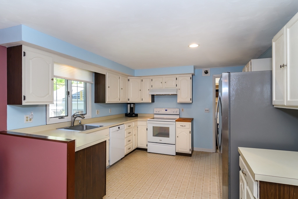 440 County Road Bourne, MA 02559 - Photo 12 of 27 a kitchen with stainless steel appliances a sink stove and refrigerator