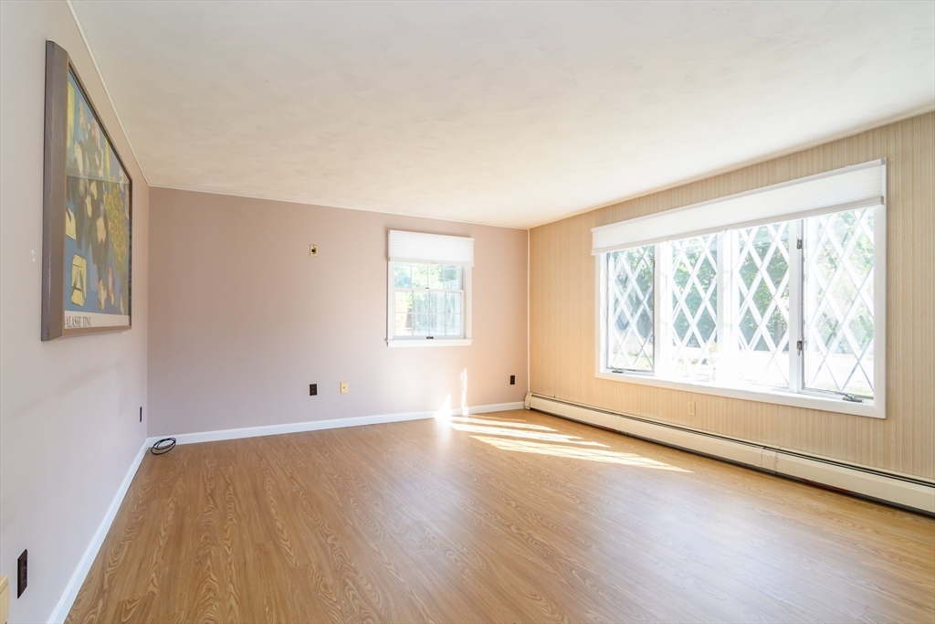 440 County Road Bourne, MA 02559 - Photo 15 of 27 an empty room with wooden floor and windows