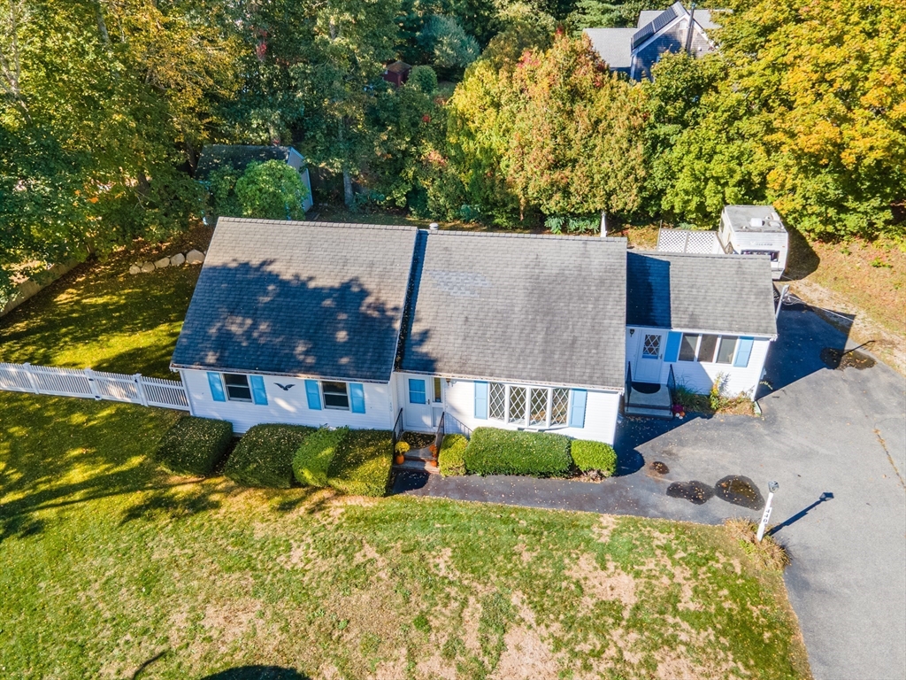 440 County Road Bourne, MA 02559 - Photo 24 of 27 aerial view of a house with large trees and a yard