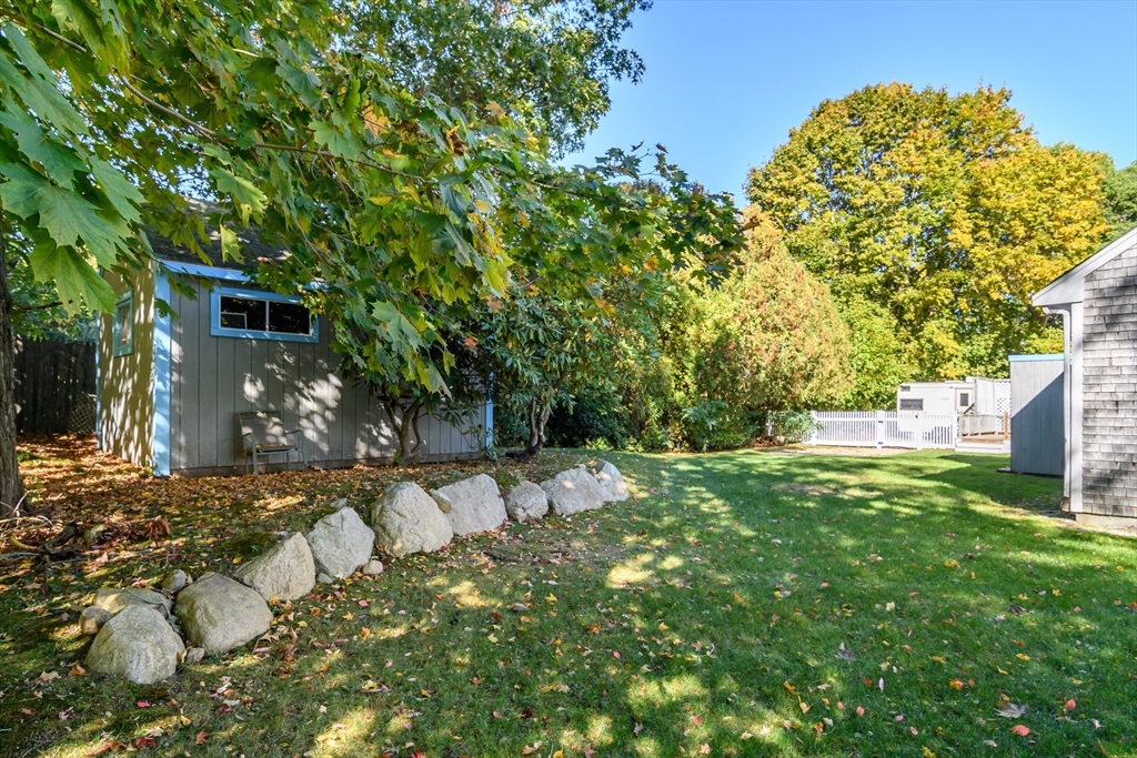 440 County Road Bourne, MA 02559 - Photo 6 of 27 a backyard of a house with table and chairs